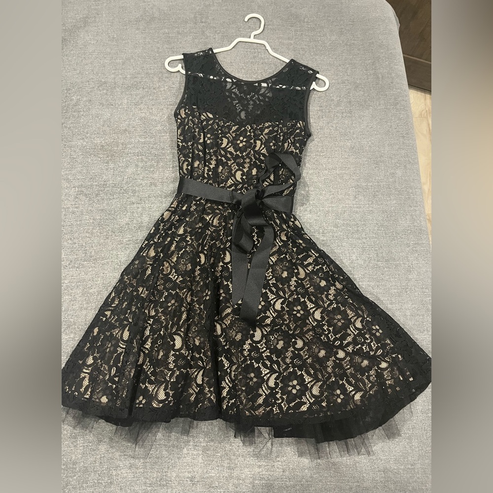 Black lace dress with beige lining. Waist tie. Bought at David’s Bridal. Size 4.